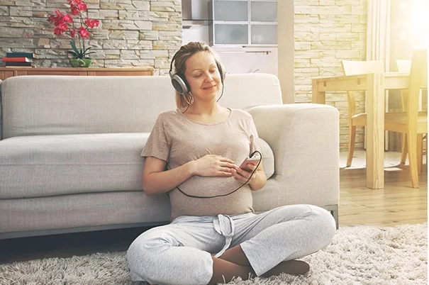 pregnant lady listening to song